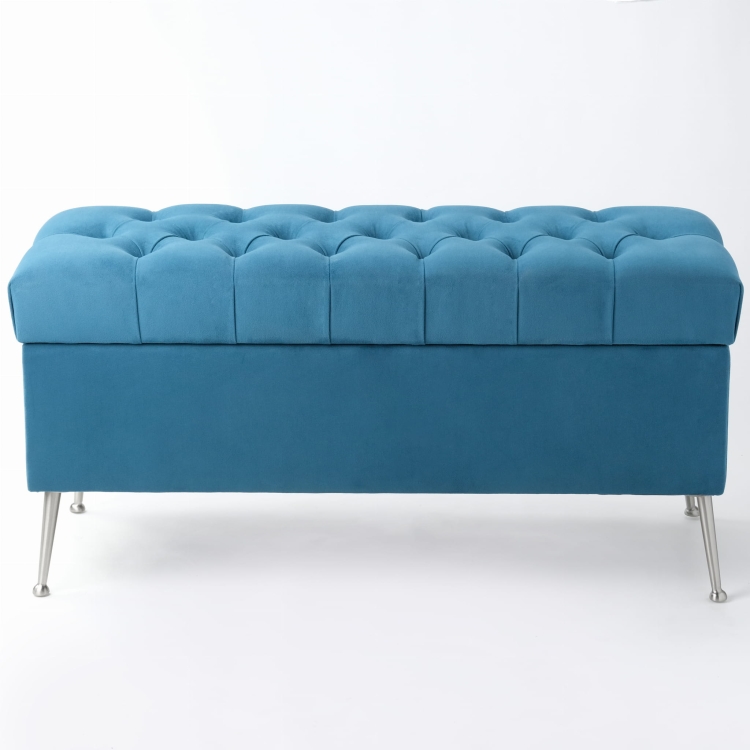 Moderner blauer Pouf mit Steppung und Stauraum, auf Metallbeinen stehend