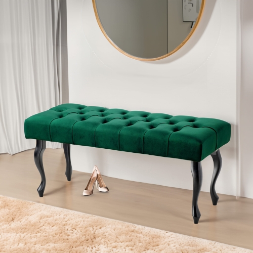 Gesteppte Bank in flaschengrünem Farbton mit schwarzen Beinen